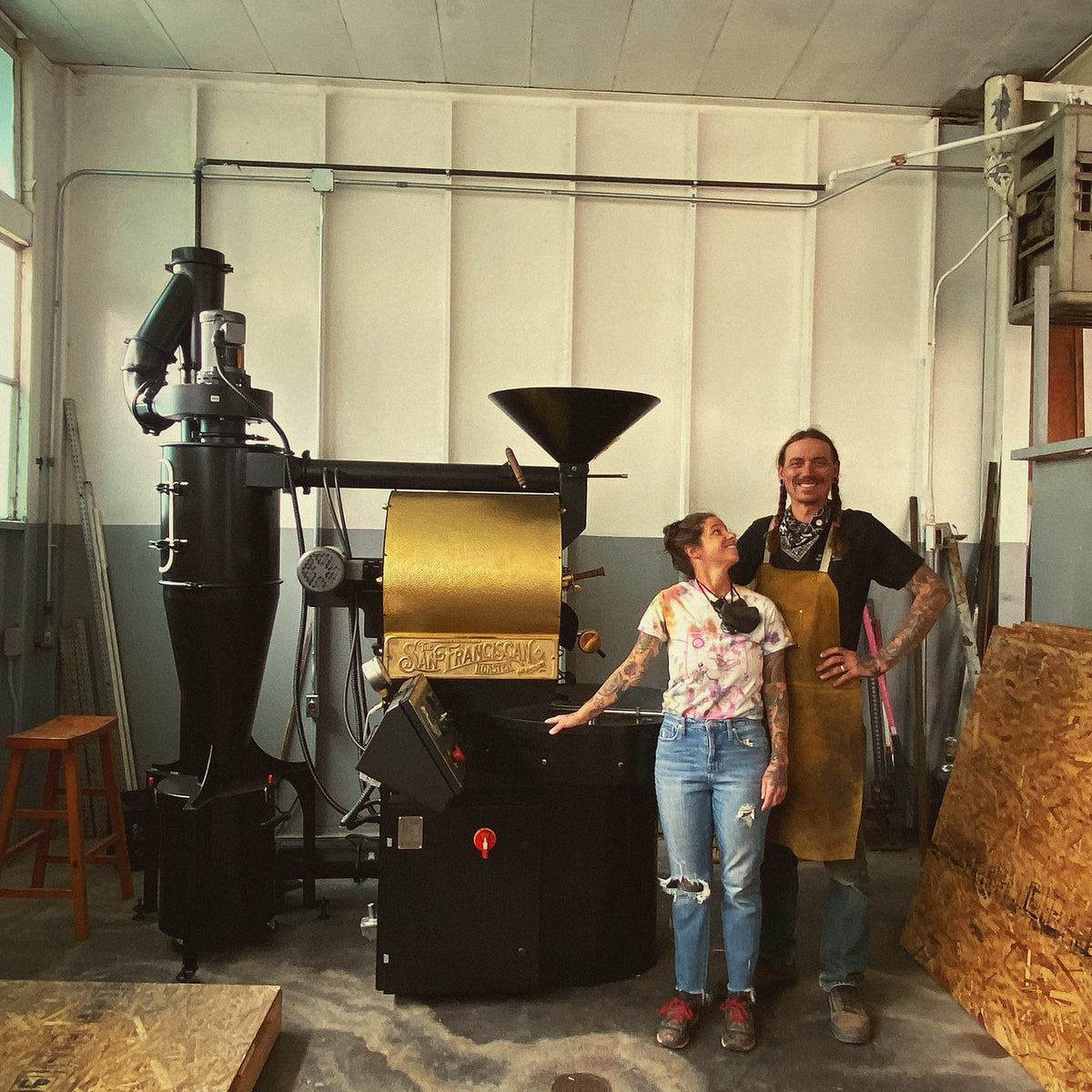 Lesley and Coleman with the roaster at Mesa Coffee